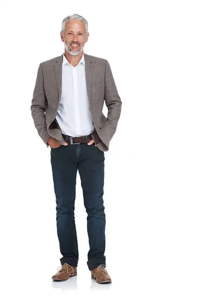 Full length portrait of young man standing on white background